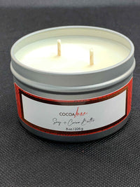 CocoaLuxe 8 oz soy and cocoa butter candle in silver tin with red and white label