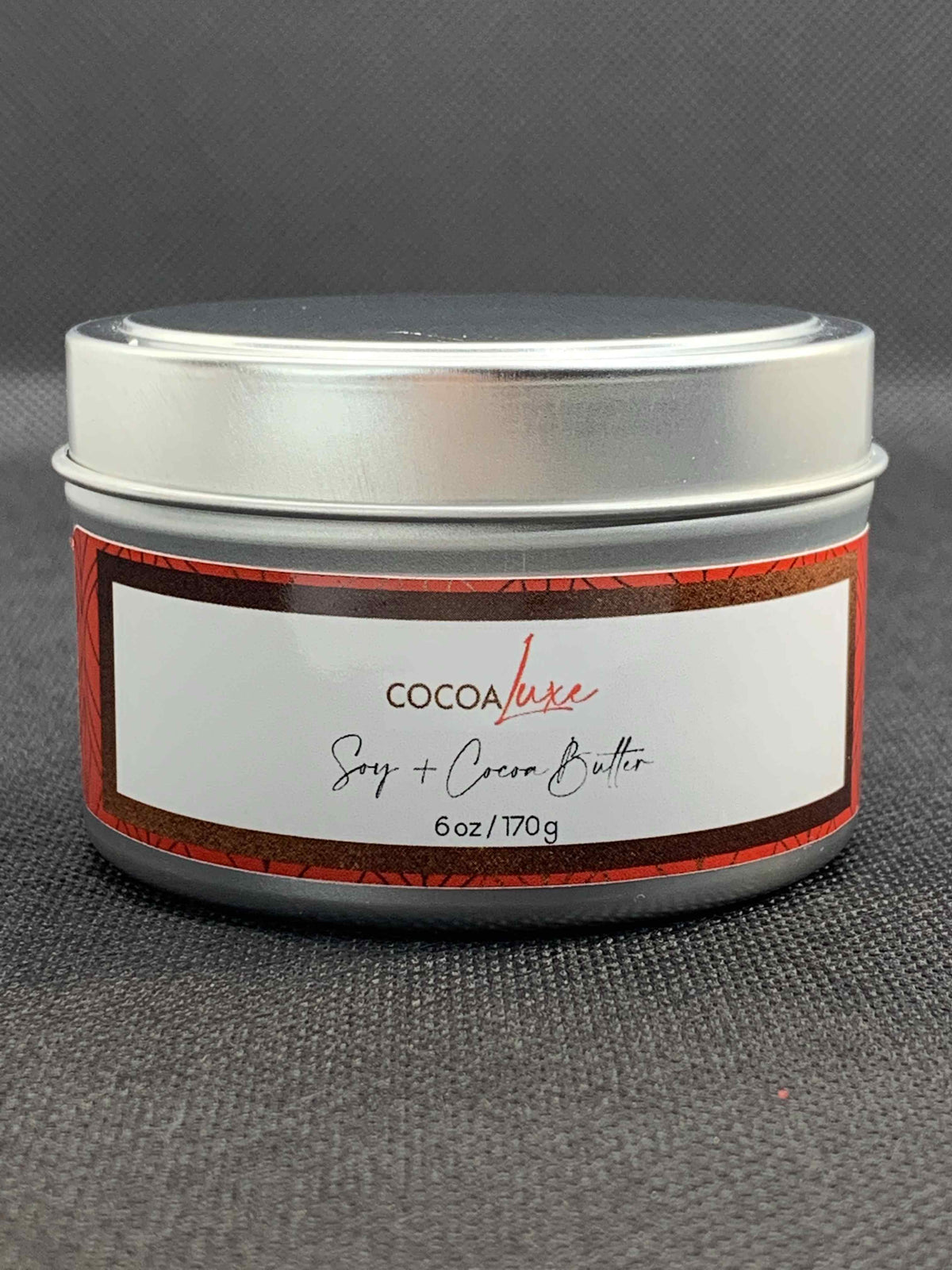 CocoaLuxe hand-poured soy and cocoa butter wax candle in 6 oz tin, front view